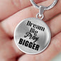 Dream Big Pray Bigger necklace in a hand to show size of pendant.