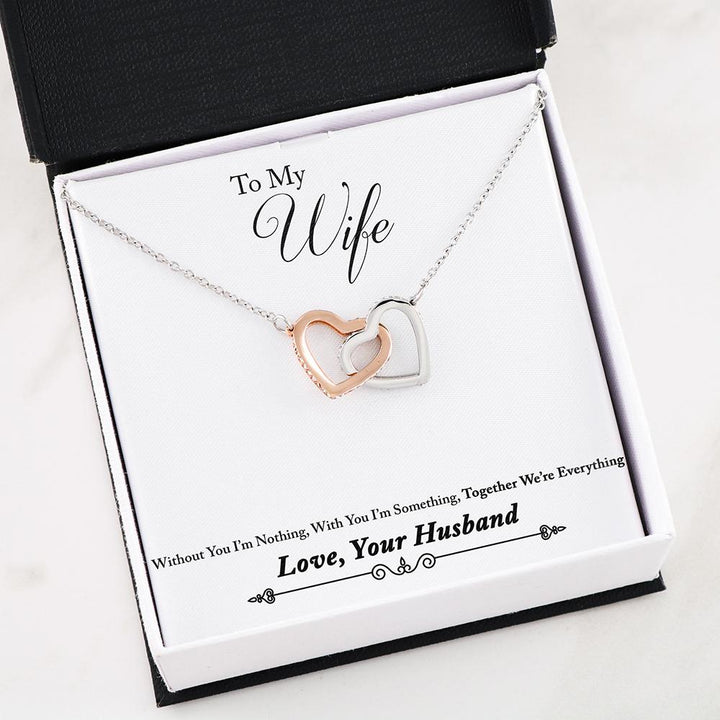 Husband and new arrivals wife interlocking necklaces